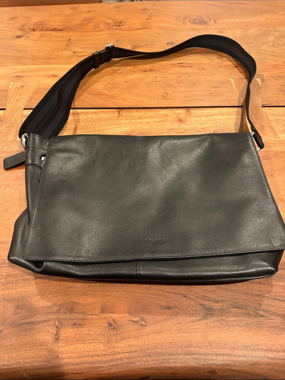 Coach Black Leather Messenger Bag with Adjustable Strap.